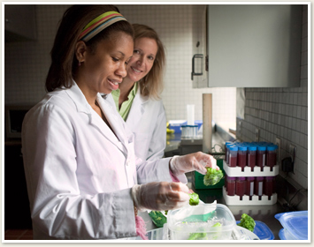 Two female students working in a lab